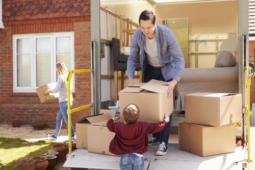 Moving boxes and furniture during a Man With Van Newington service