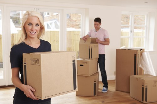 Loading furniture and boxes into a removal van in Newington