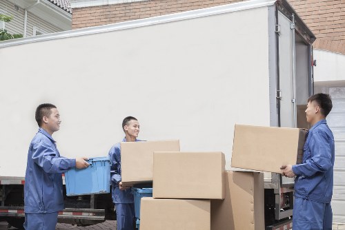 Furniture and boxes being organised inside a removals van