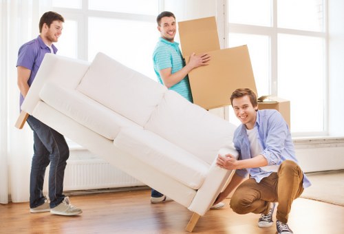Careful wrapping of fragile household items during packing services in Newington