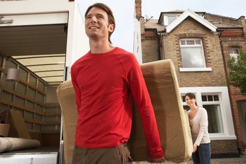 Furniture and boxes being loaded into a moving van