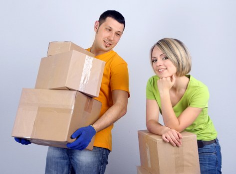 Removal team handling furniture in a Newington property