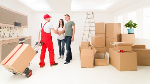 Loading furniture into a removal truck in Newington