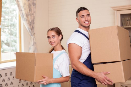 Small flat move with furniture carried carefully down stairs in Newington